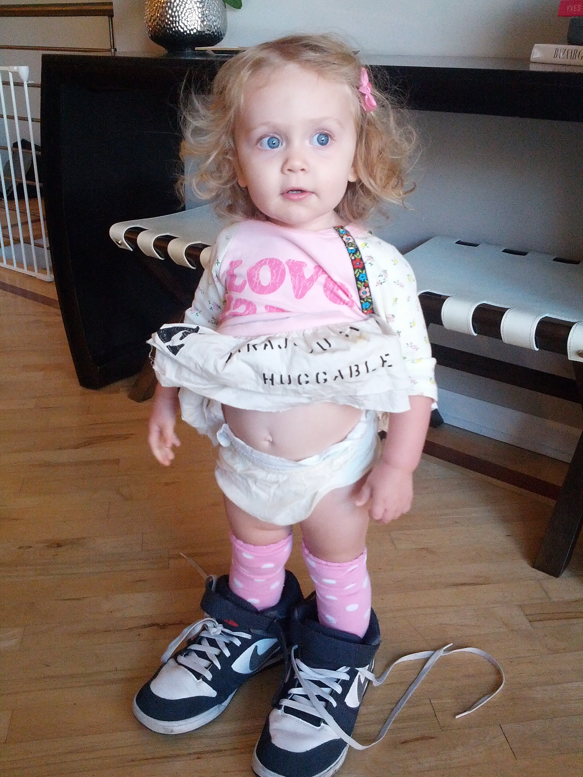 Frankie wearing my shoes and pulling her dress up so it only reads "huggable"